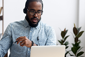 man talking on the computer